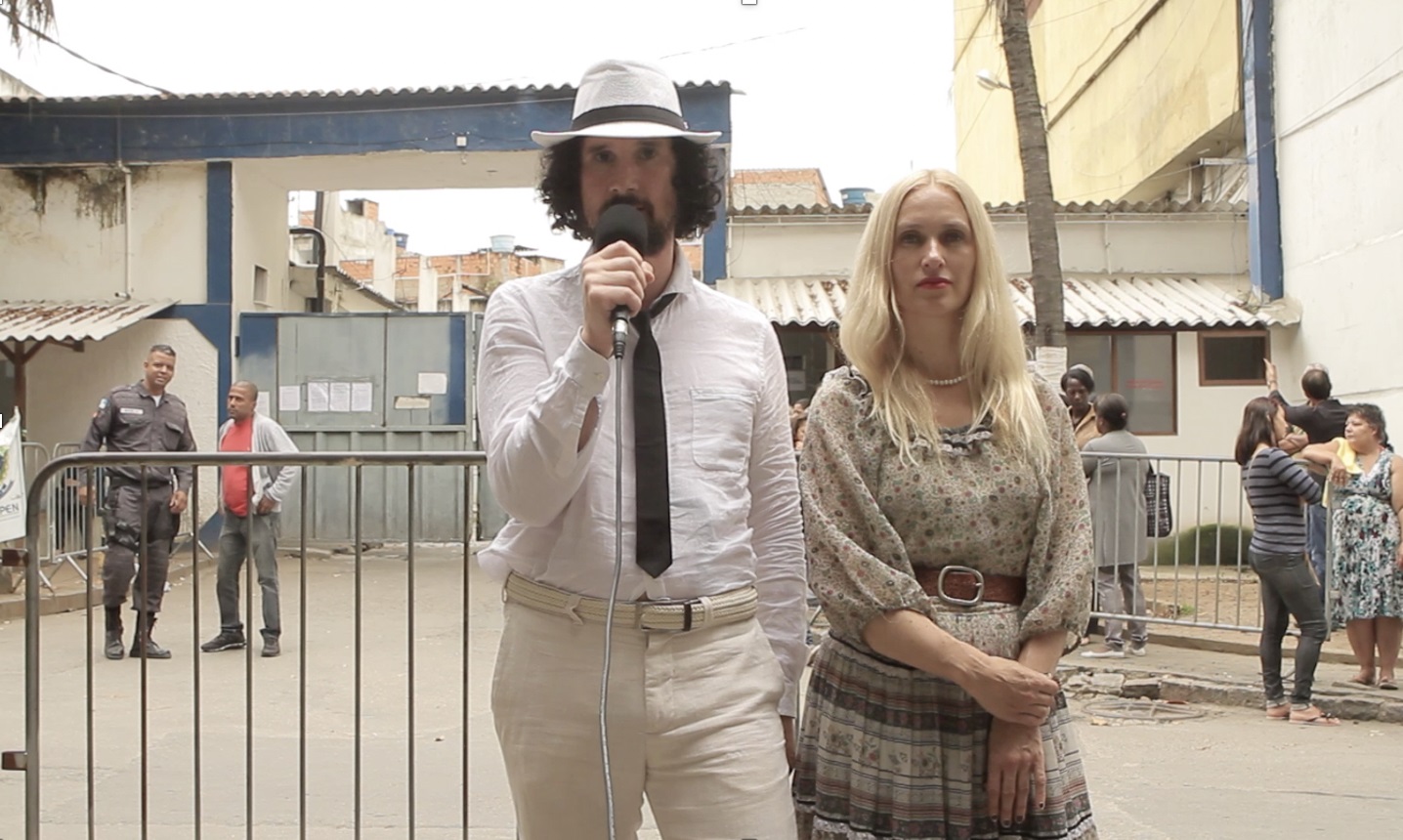 Julian Blaue and Edy Poppy in front of the prison where one of the assaulters was held, Rio de Janeiro, 2018